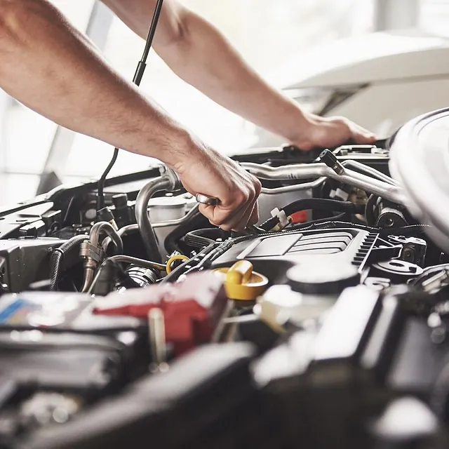 mechanic working on an engine